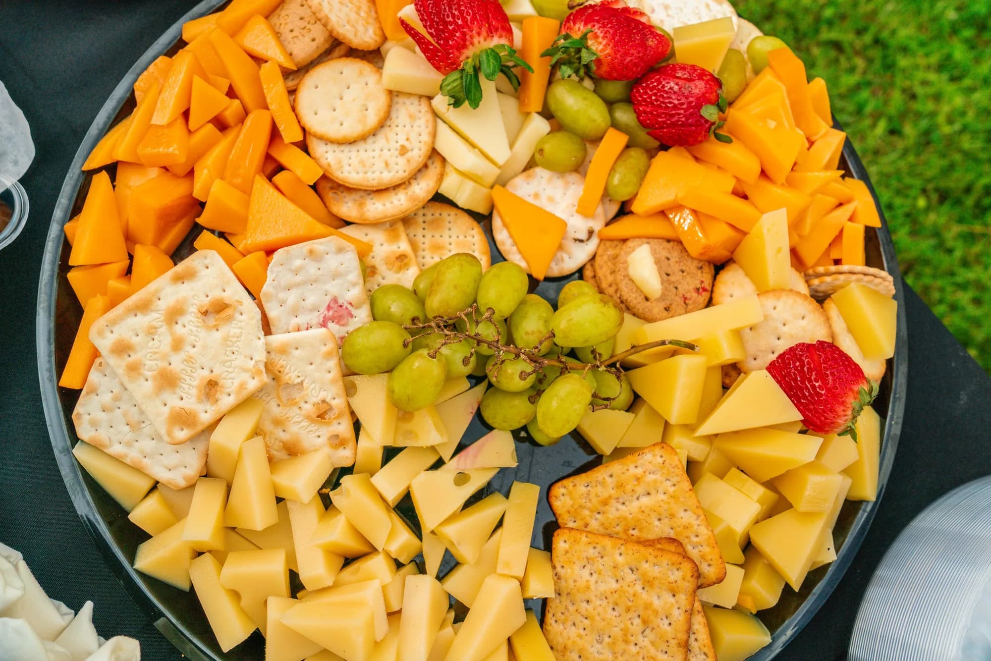Cheese, cracker and fruit platter for a catered gathering