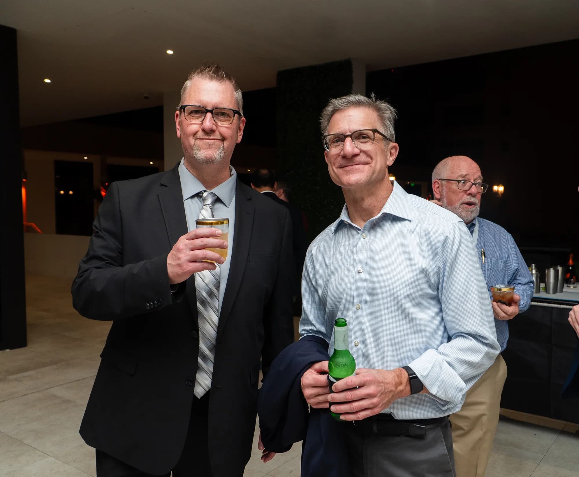 Colleagues at a corporate mixer with drinks