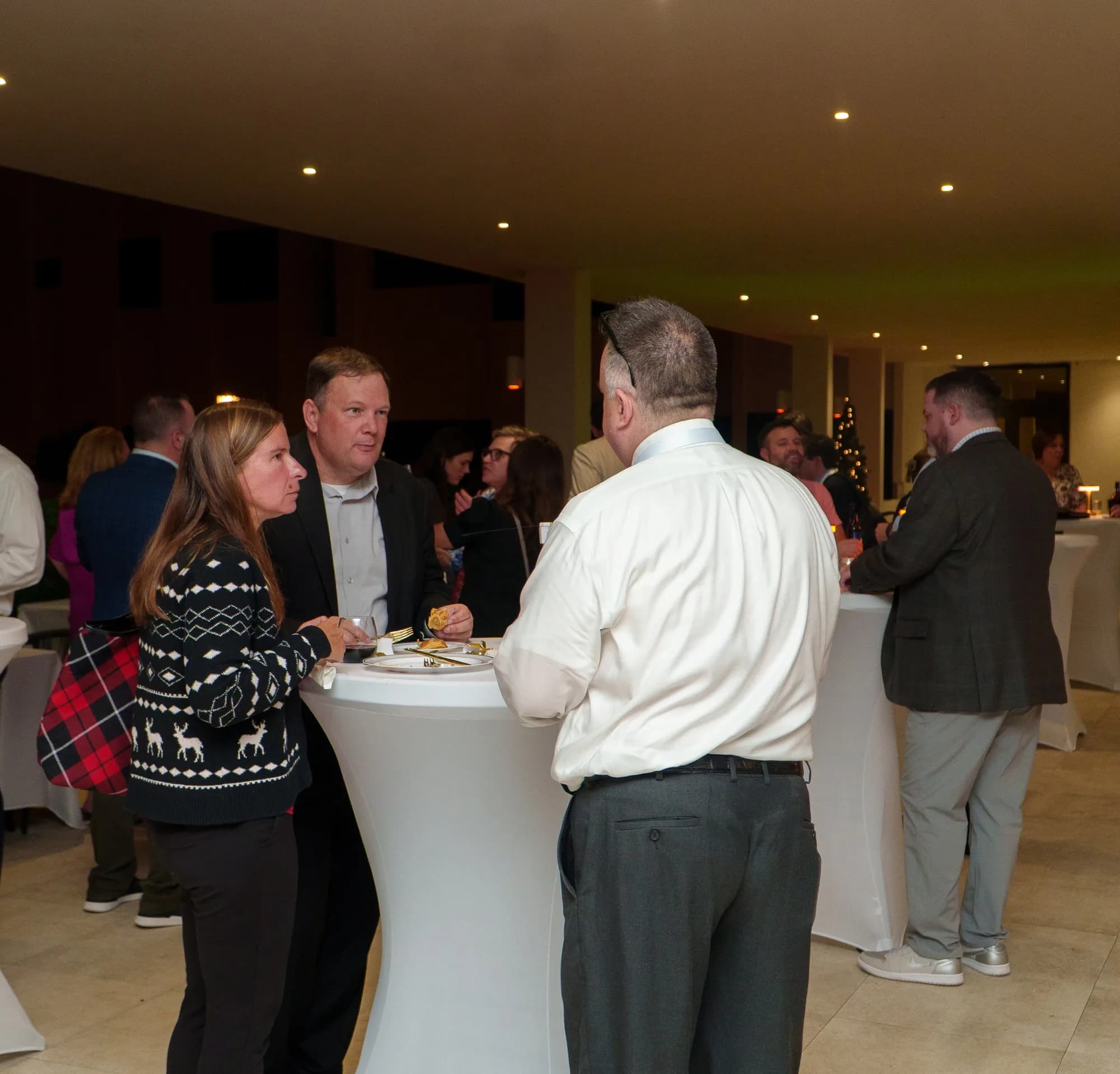 Guests in conversation at a corporate reception