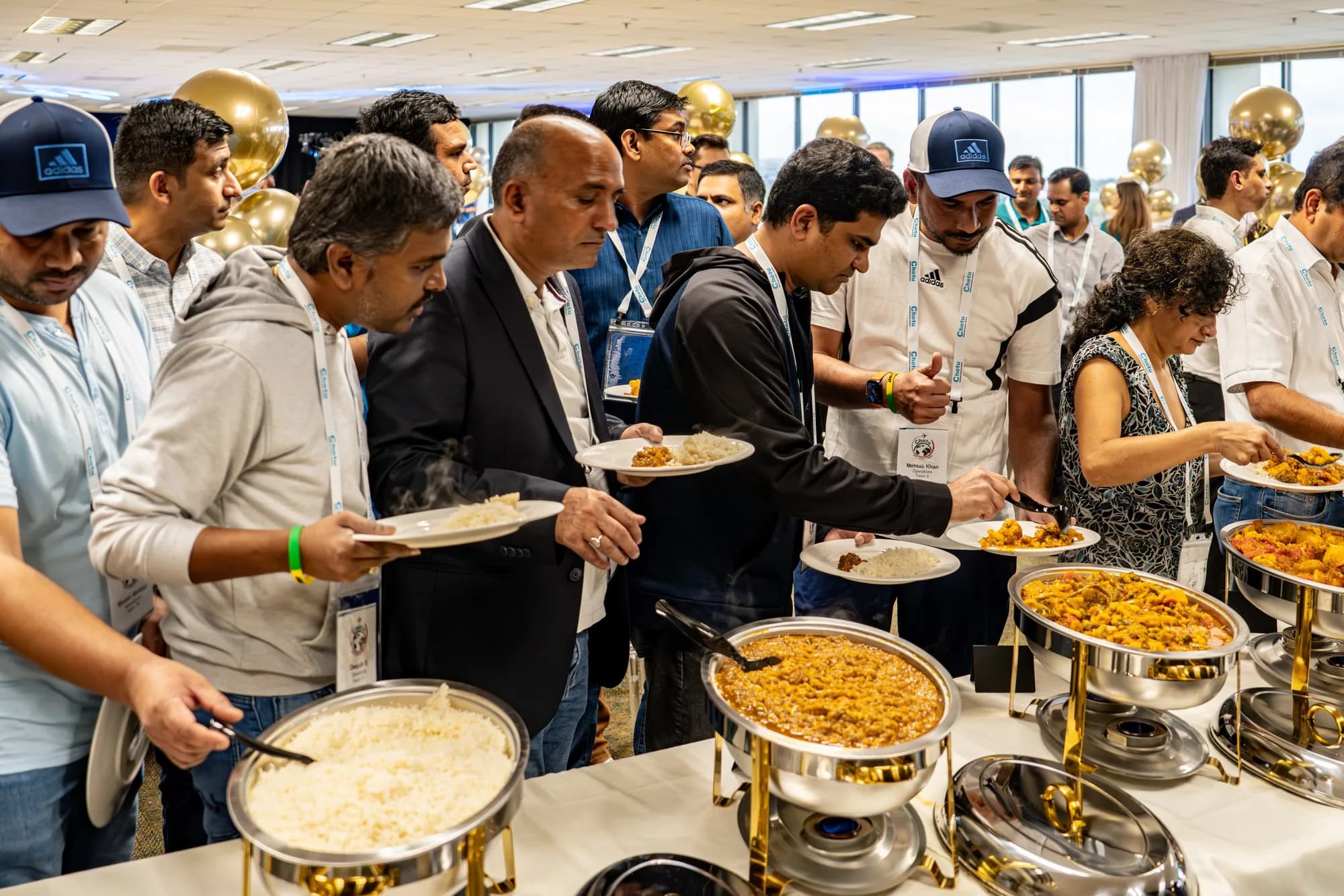 Guests serving themselves at a corporate buffet