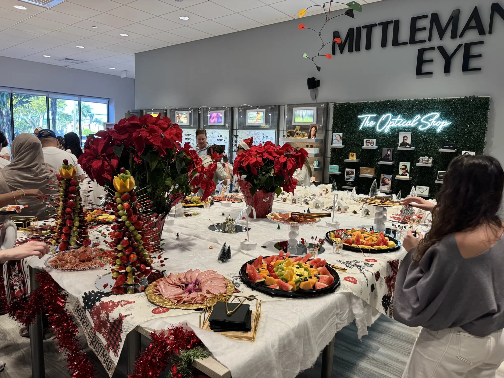 Corporate holiday party buffet with poinsettias