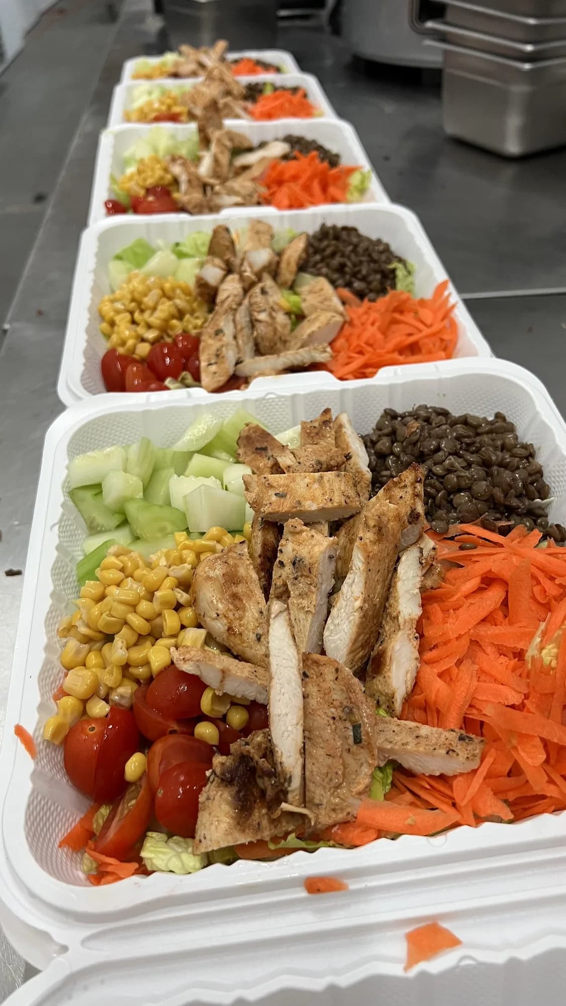 Grilled chicken salads packed for delivery