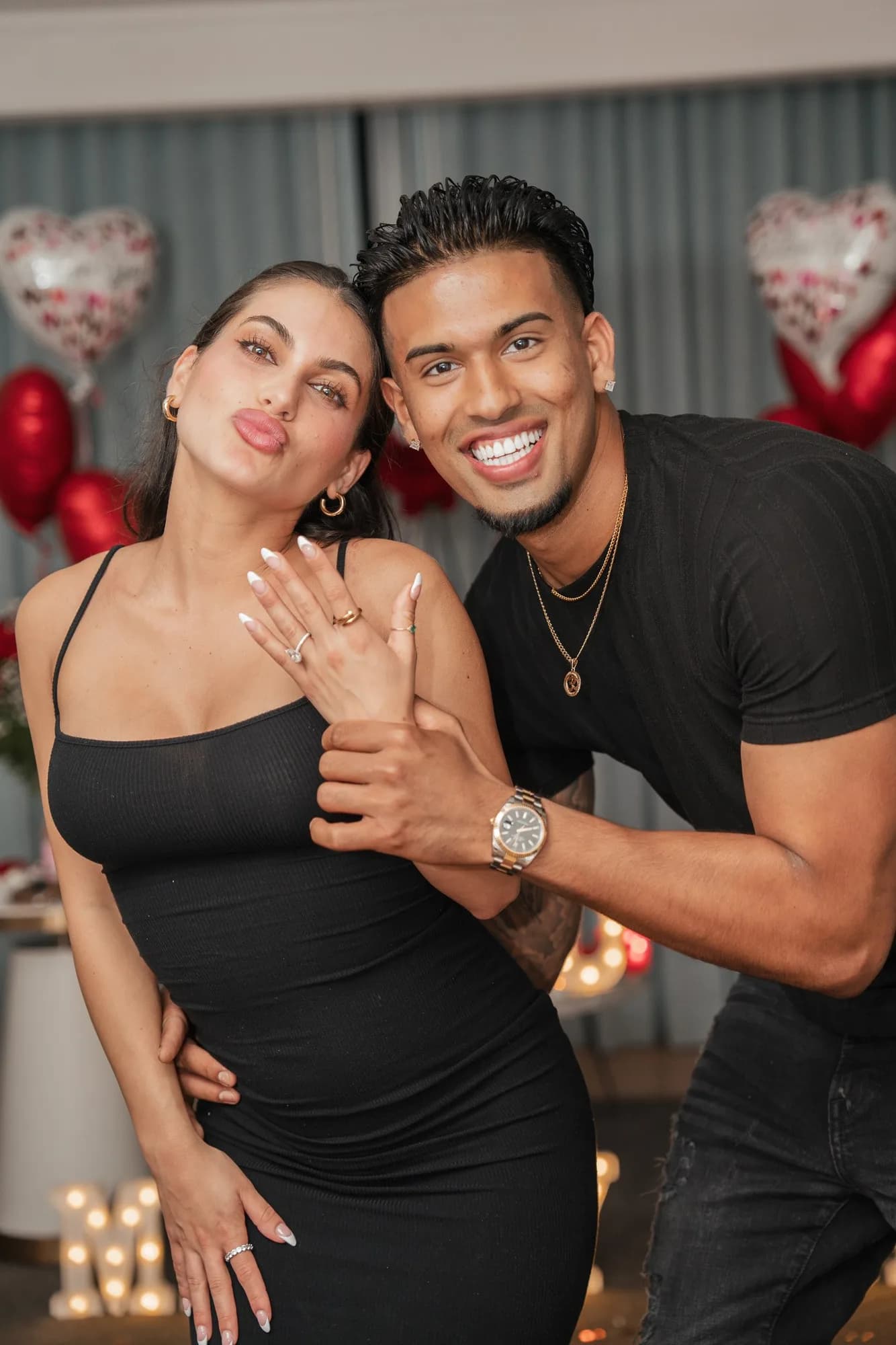 Newly engaged couple after a planned proposal