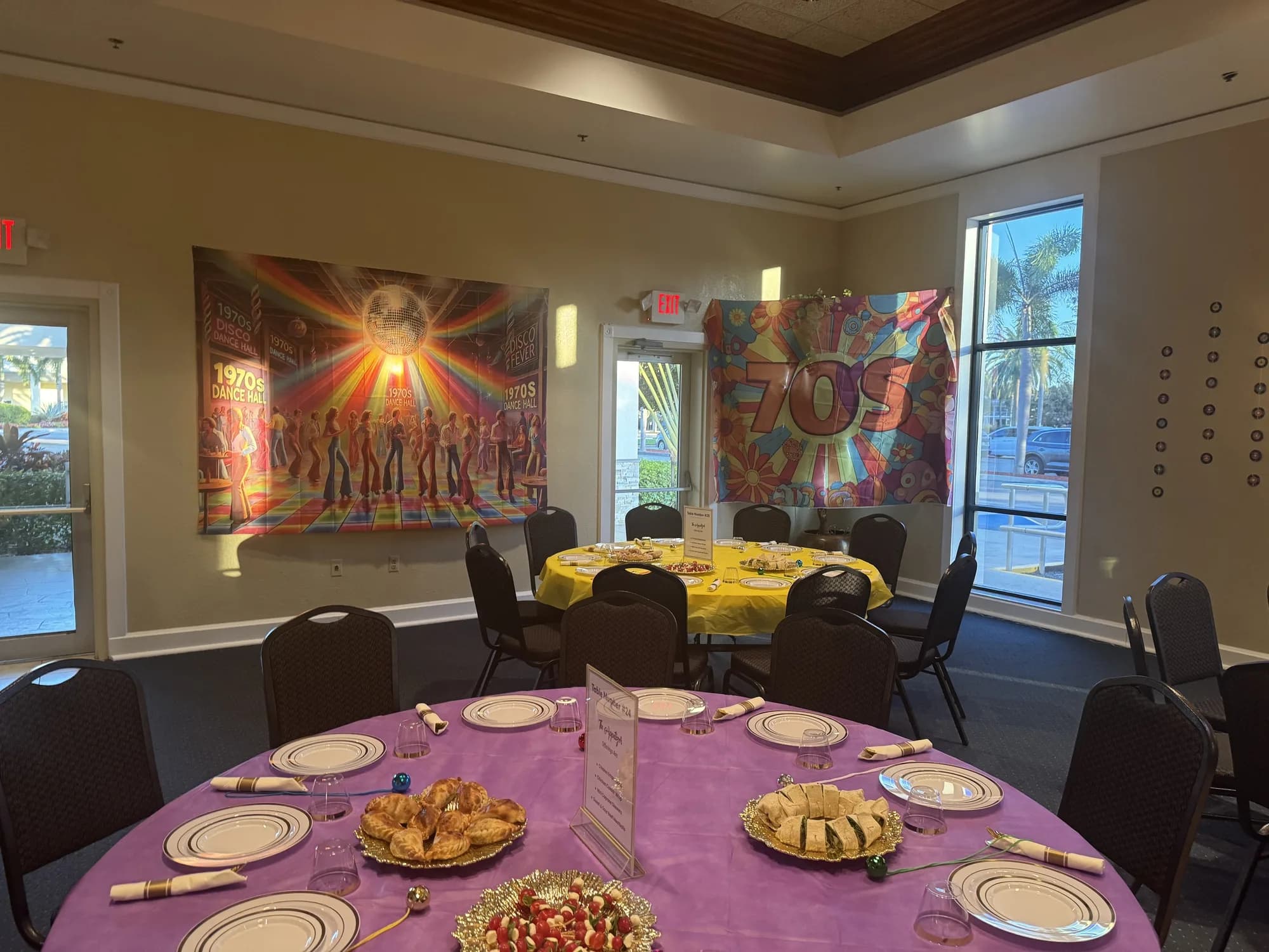 Purple linen table setting with appetizers in an art space
