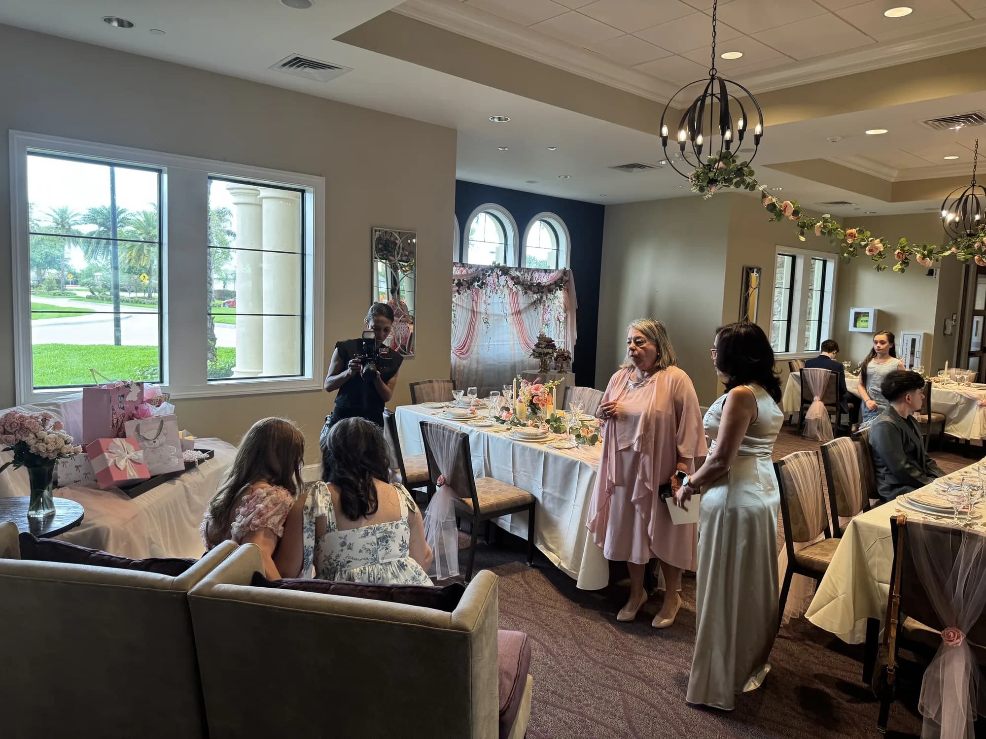 Quinceañera tables with greenery garland