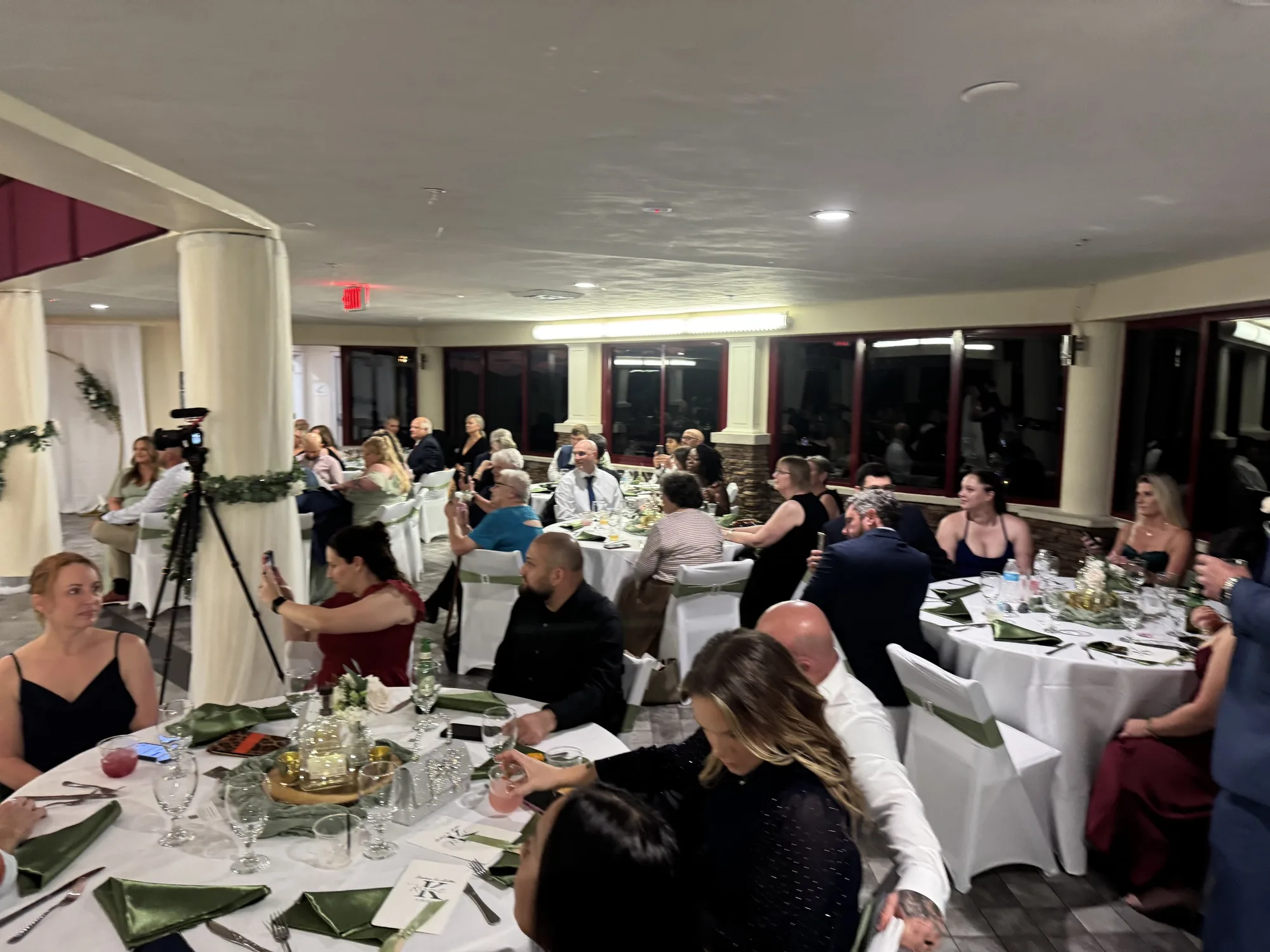 Wedding guests seated at reception tables